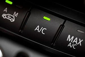 Mobile mechanic servicing a car air conditioning system in Jacksonville, FL